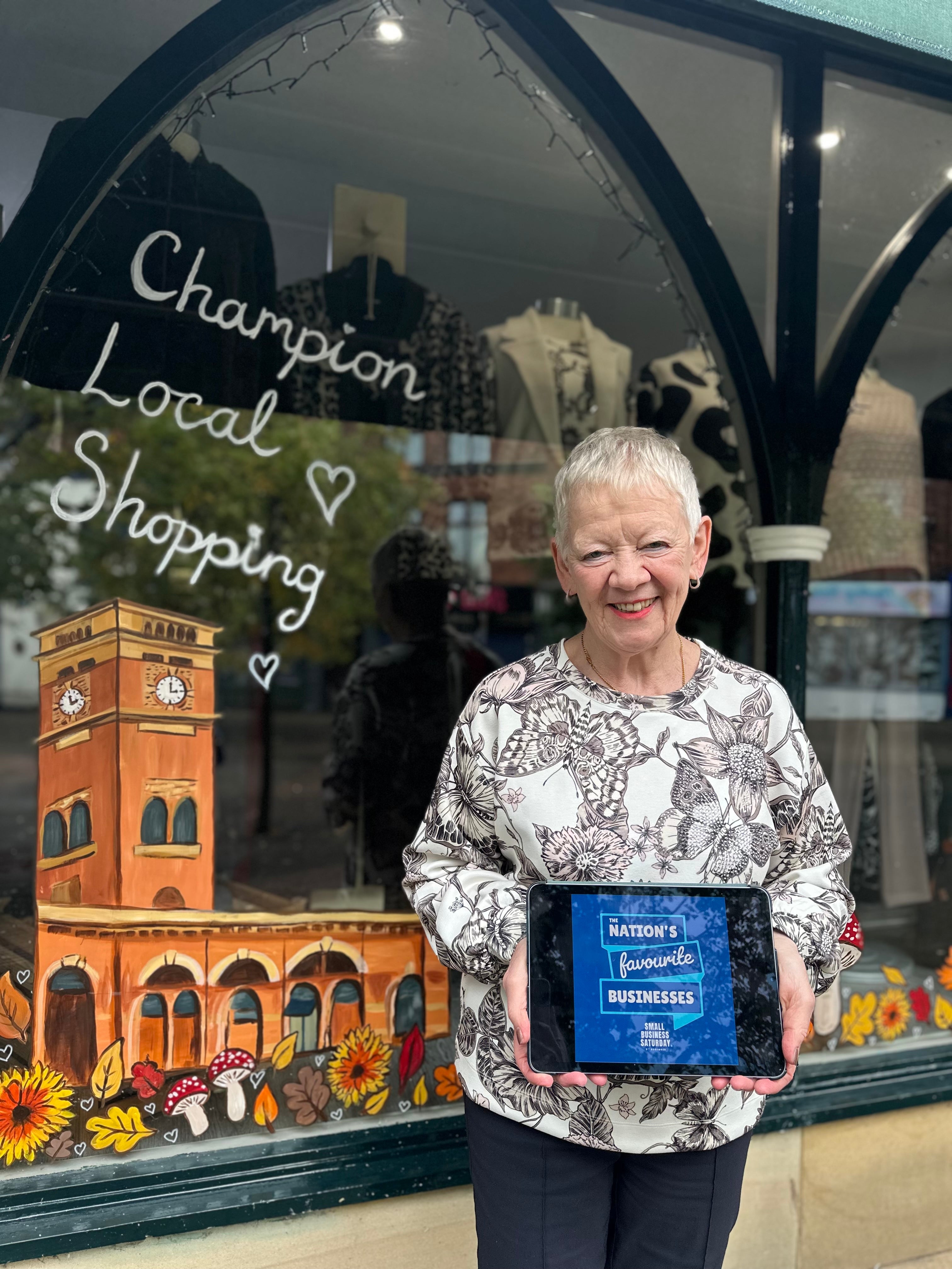 Val Unwin celebrating Decisions Clothing's place on the Nation's Favourite Businesses list